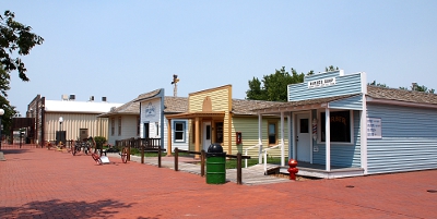 [A row of colorfully painted wooden buildings.]